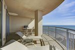 Beach balcony has plenty of seating for relaxing, eating and grilling. 